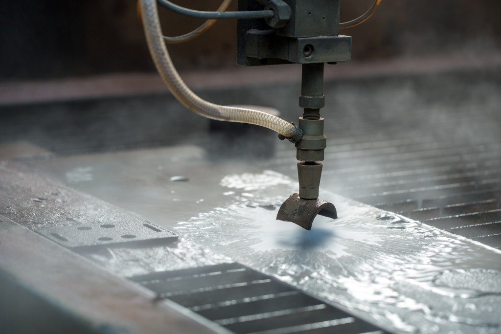 waterjet cutting machine fabricating the metal