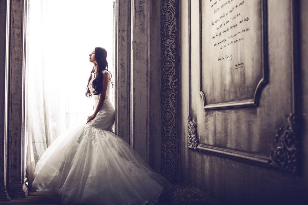 bride sitting near the window