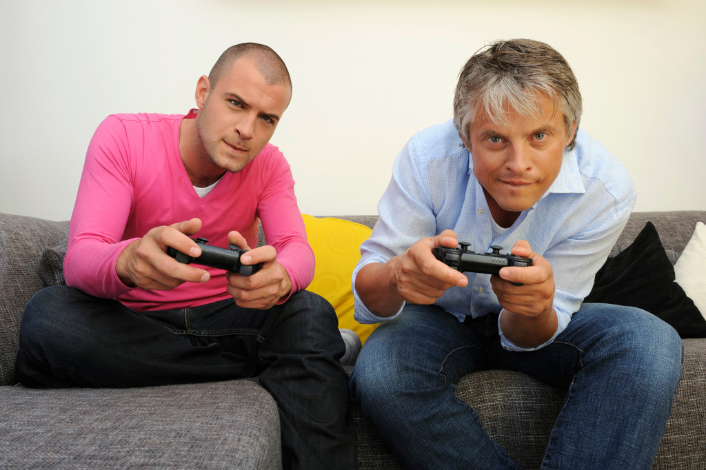men playing gaming console
