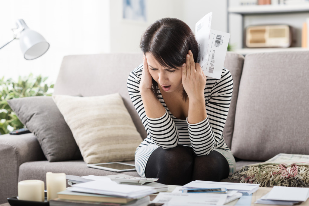 A woman having serious anxiety about bills