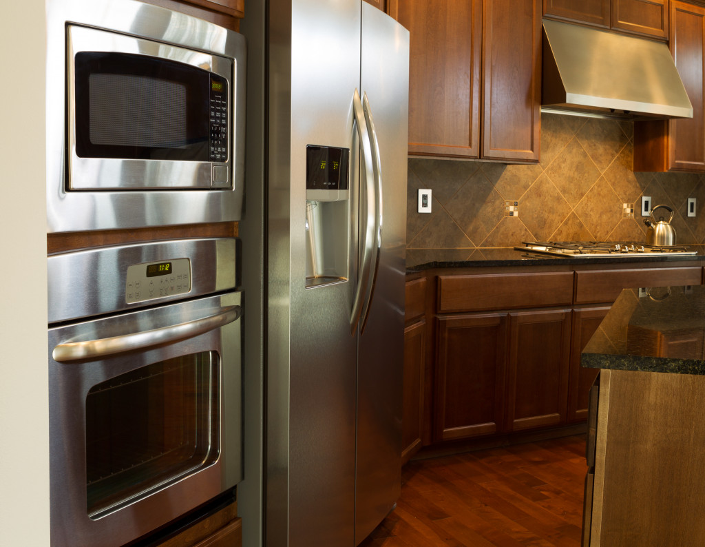 Modern kitchen with a refrigerator, stove, oven, and microwave