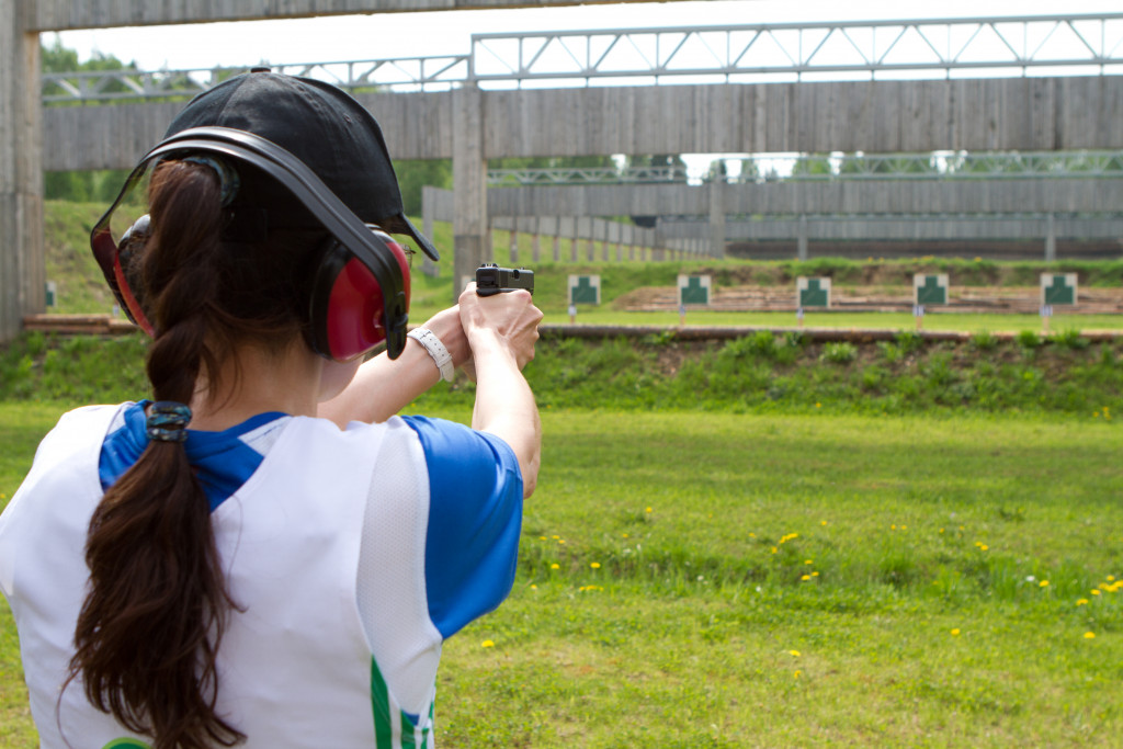 woman pointing gun at the target