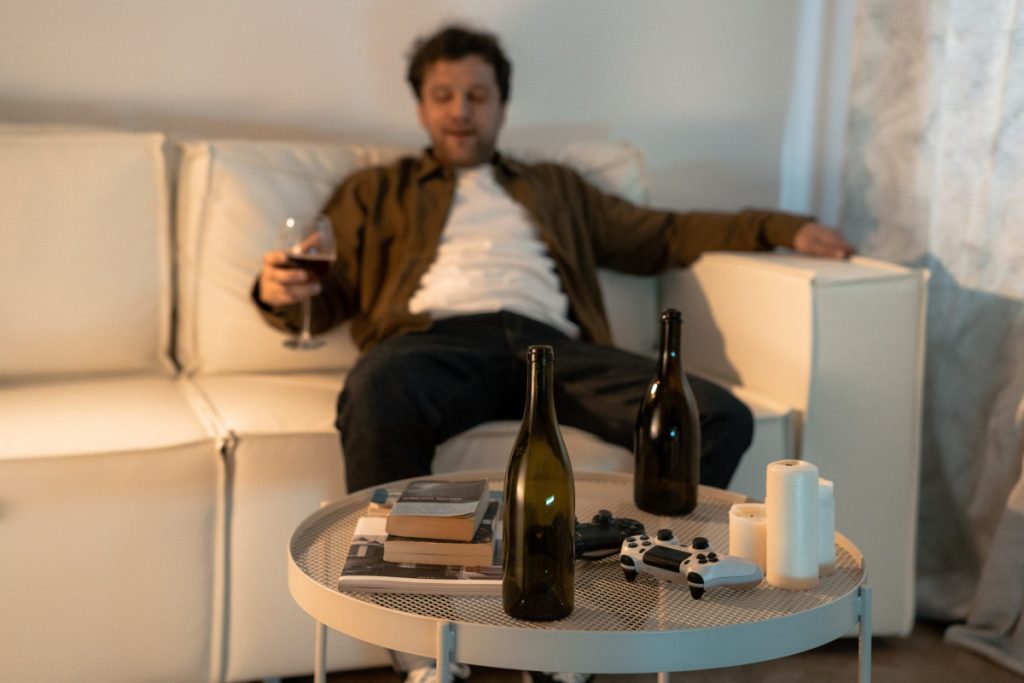 Man having too much alcohol alone